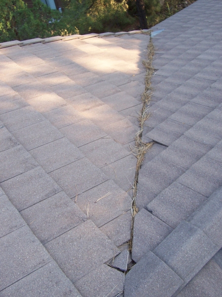 Broken Roof Tile and Debris in Valley Metal